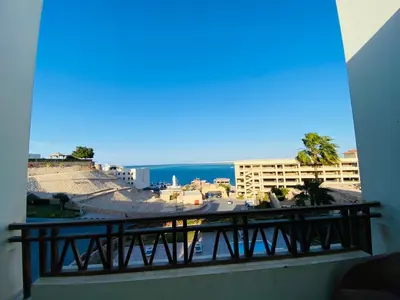 a balcony with a view of the ocean at The Hill House in Hurghada