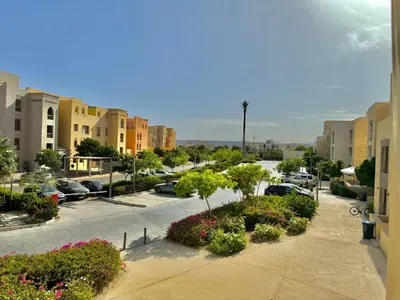 a city street with cars parked in a parking lot at One bedroom Mangroovy El Gouna in Hurghada