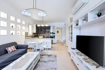 a living room with a large flat screen tv at Townhouse with roof terrace,balcony and large pool in Hurghada