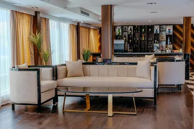 a living room with a couch and a bar at Savoy Yacht - Exclusive Nile Cruise from Luxor to Aswan in Luxor