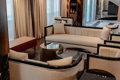a living room with couches and a table and chairs at Savoy Yacht - Exclusive Nile Cruise from Luxor to Aswan in Luxor