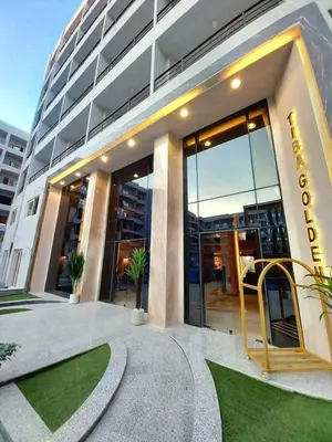 a building with a sign on the front of it at Sami and Sam studio apartment in Hurghada