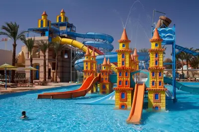 a water park with a water slide in the water at Chalet - Mirage Bay Resort & Aqua Park in Hurghada