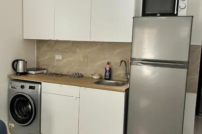 a kitchen with a stainless steel refrigerator and a sink at Hurghada Concierge at Fiesta Beach Resort 411 in Hurghada