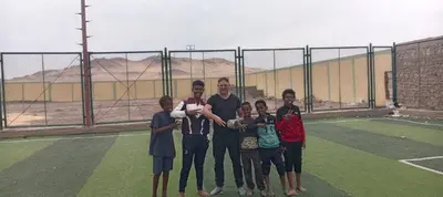 a group of people standing on a tennis court at Abo Orabi Guest House in Aswan