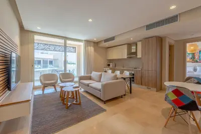 a living room with a couch and a table at Cozy One Bedroom in Mangroovy in Hurghada