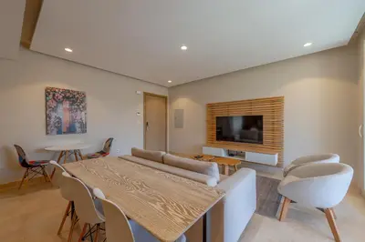 a living room with a couch and a table at Cozy One Bedroom in Mangroovy in Hurghada
