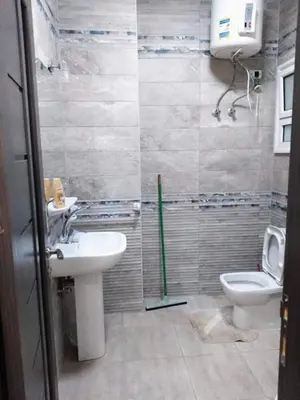a bathroom with a sink and a toilet at Compound El makramia 504 in Hurghada