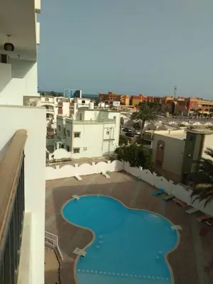 a view of a swimming pool on top of a building at Compound El makramia 504 in Hurghada