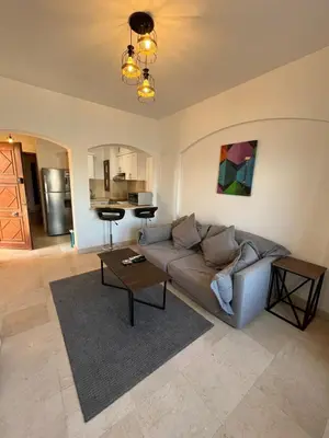 a living room with a couch and a table at El Gouna Sabina Y160 in Hurghada