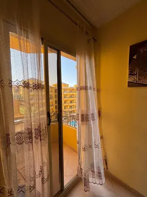 a room with a window with a view of a building at Stefy Holiday Hurghada in Hurghada