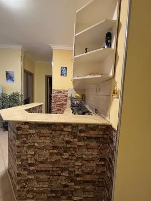 a kitchen with a stone counter with a sink at Stefy Holiday Hurghada in Hurghada