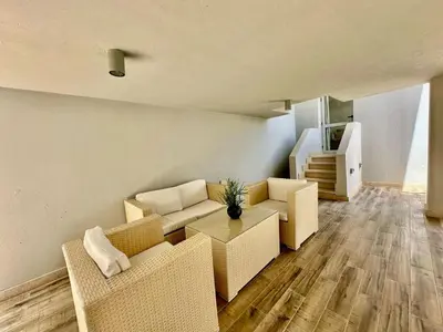 a living room with two couches and a table at Cozy 2 bedroom Sholan 1 - Gouna in Hurghada