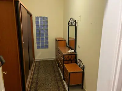 a bathroom with a dresser and a mirror at فيلا للإيجار فى مجاويش الغردقة in Hurghada