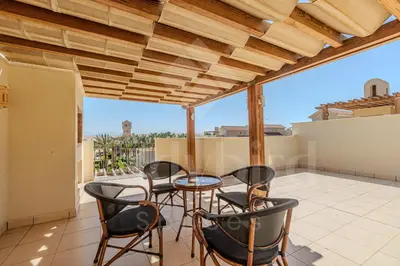 an image of a patio with chairs and a table at Ladybird - Veranda Nest in Hurghada