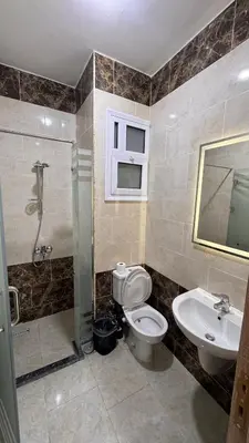 a bathroom with a toilet and a sink and a shower at Stunning sea view Apartment in Hurghada