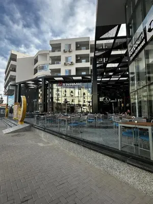 a building with tables and chairs in front of it at Stunning sea view Apartment in Hurghada