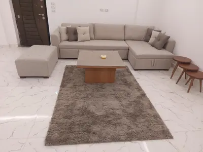 a living room with a couch and a coffee table at Fanadir L406 in Hurghada