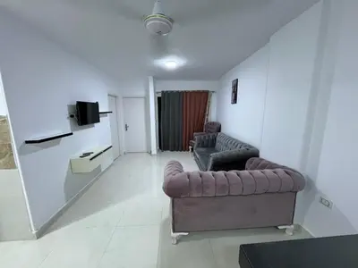 a living room with two chairs and a couch at Avin Resort Hurghada in Hurghada