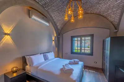 a bedroom with a bed with two towels on it at Sahlhasheesh villa with heated pool and Jacuzzi in Hurghada