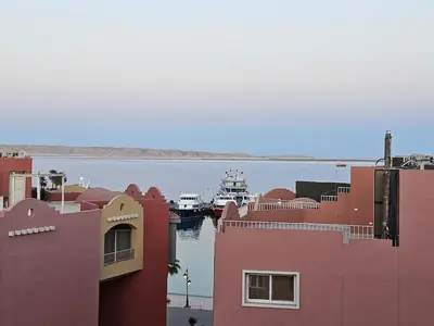 a boat is docked in a body of water at Marina Views Hurghada in Hurghada