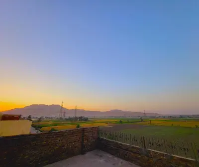 a view from the roof of a building at sunset at Casablanca guest house᭄ꦿ in Luxor