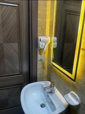 a bathroom with a white sink and a mirror at Hurghada s 30 in Hurghada