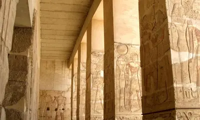 a room with paintings on the walls of a building at Desert Rose in Luxor
