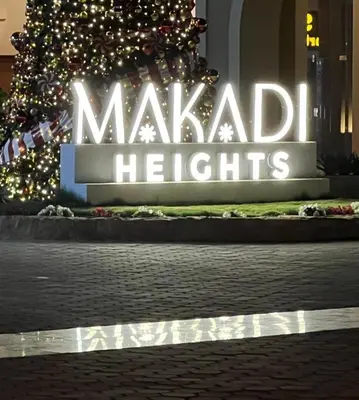 a sign for a makaila lights in front of a christmas tree at 2 bed rooms apartment in makadi heights in Hurghada
