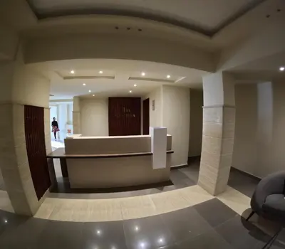 a lobby with a reception desk in a building at avenue compound in Hurghada