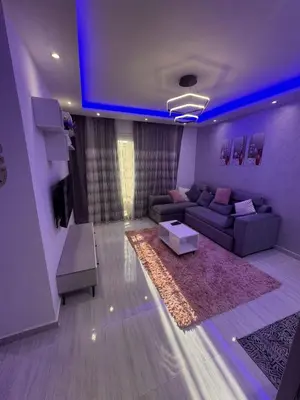 a living room with a couch and a blue ceiling at avenue compound in Hurghada