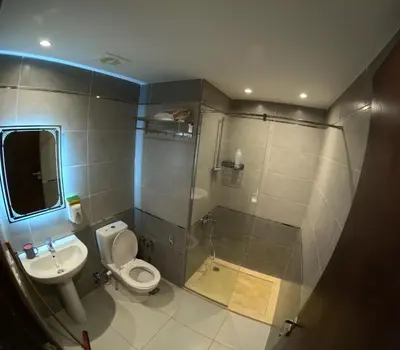 a bathroom with a toilet and a sink and a shower at avenue compound in Hurghada