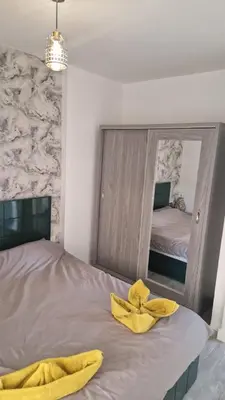 a bedroom with a bed with yellow towels on it at Imperial resort Hurghada, 1 bedroom luxury resort in Hurghada