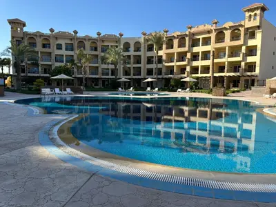 a large swimming pool in front of a building at Al Saraya Sahl Hasheesh by Peaks One Bedroom Apartment With Pool View C101 in Hurghada