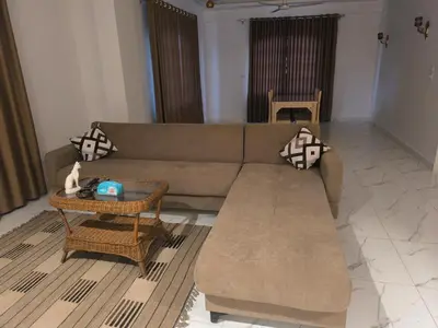 a living room with a couch and a table at King House in Luxor