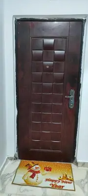 a brown door with a sign in front of it at اويسيس مارينا in Hurghada
