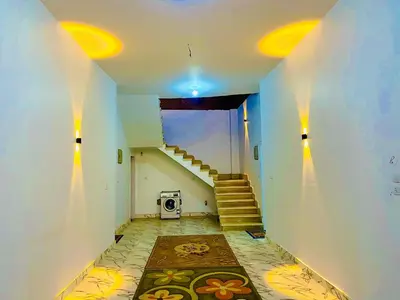 a staircase in a house with a stair case at Taha Guest house in Luxor