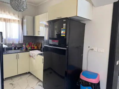a kitchen with a black refrigerator and a sink at NEXT STAY, 3BR Villa, El Gouna in Hurghada