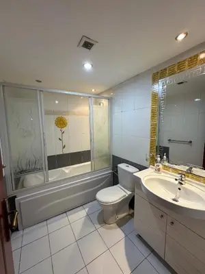 a bathroom with a toilet and a tub and a sink at Panoramic Sea View in Hurghada