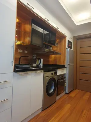 a kitchen with a washing machine and a washer at luxury apartment with sea view in Hurghada