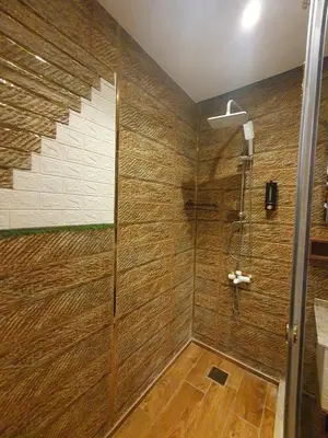 a shower with a glass door in a bathroom at luxury apartment with sea view in Hurghada