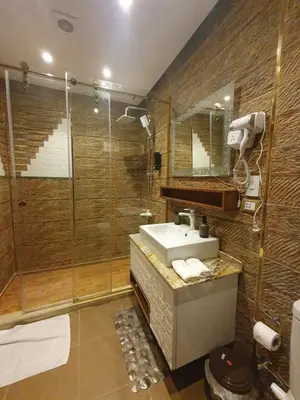 a bathroom with a sink and a shower at luxury apartment with sea view in Hurghada