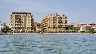 a view of a resort from the water with buildings at Studio in turtels beach in Hurghada