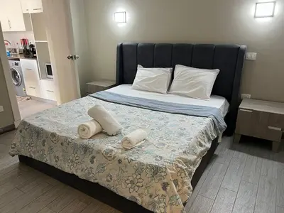 a bedroom with a bed with two towels on it at One Bedroom Apartment in El Gouna Bali in Hurghada
