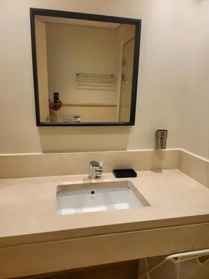 a bathroom sink with a large mirror above it at ELgouna Mangroovy stylish 4 bedroom in Hurghada