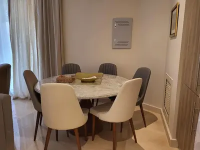 a dining room with a table and chairs at ELgouna Mangroovy stylish 4 bedroom in Hurghada