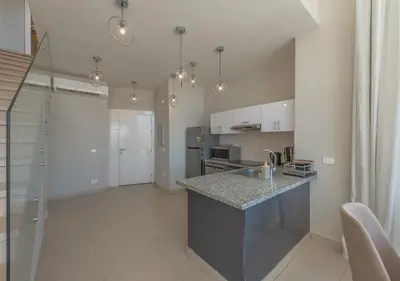 a kitchen with a counter top in a room at Beautiful 4BR Villa in Tawila El Gouna Private Pool & Lagoon Access in Hurghada