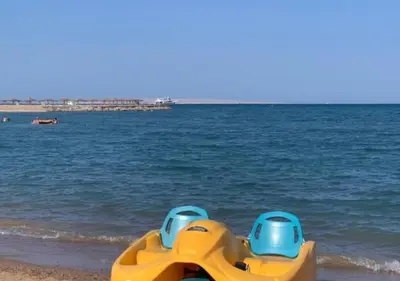 a yellow and blue toy on the beach at Luxury Cecelia resort in Hurghada