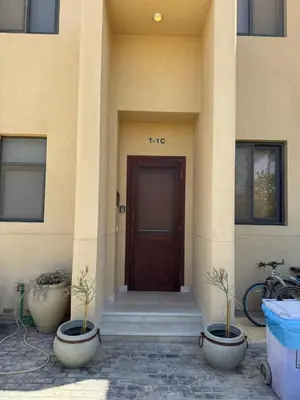 a front door of a building with two plants at NEXT STAY, Lagoon Townhouse, El Gouna in Hurghada