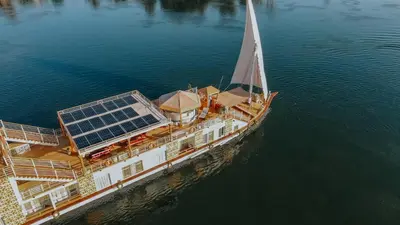 an aerial view of a boat in the water at Azhar Dahabiya luxury suites in Esna